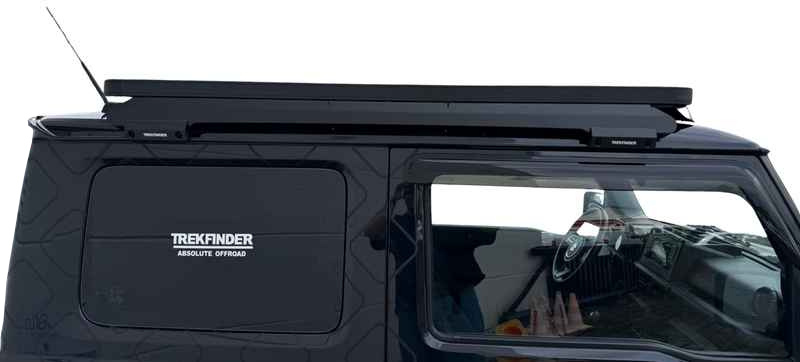 Suzuki Jimny II mit TREKFINDER Dachträger - Seitenansicht